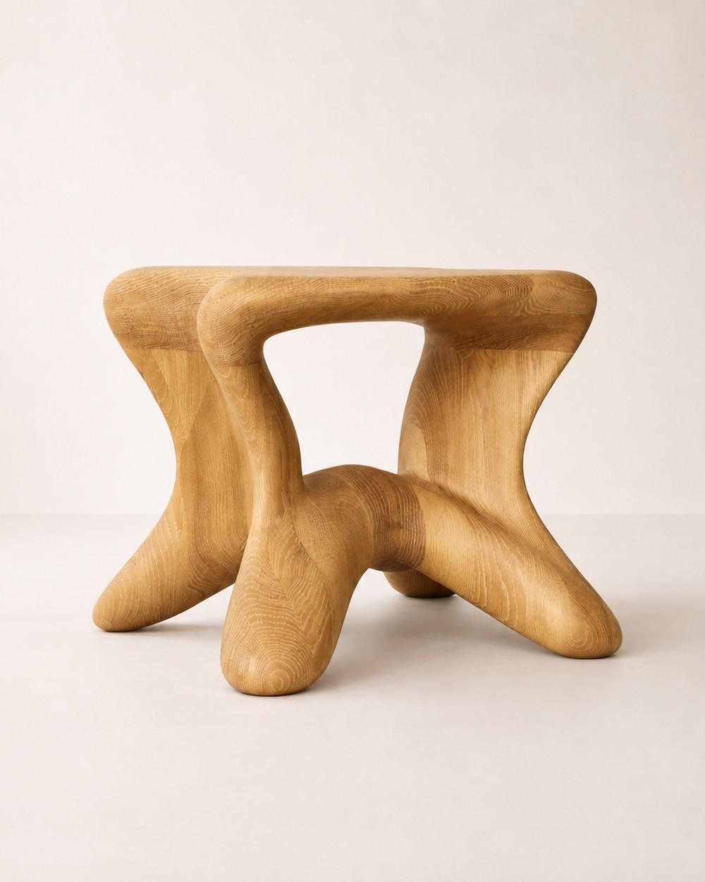 Aura by NEXART — A wooden stool with an organic seat and an open, flowing base