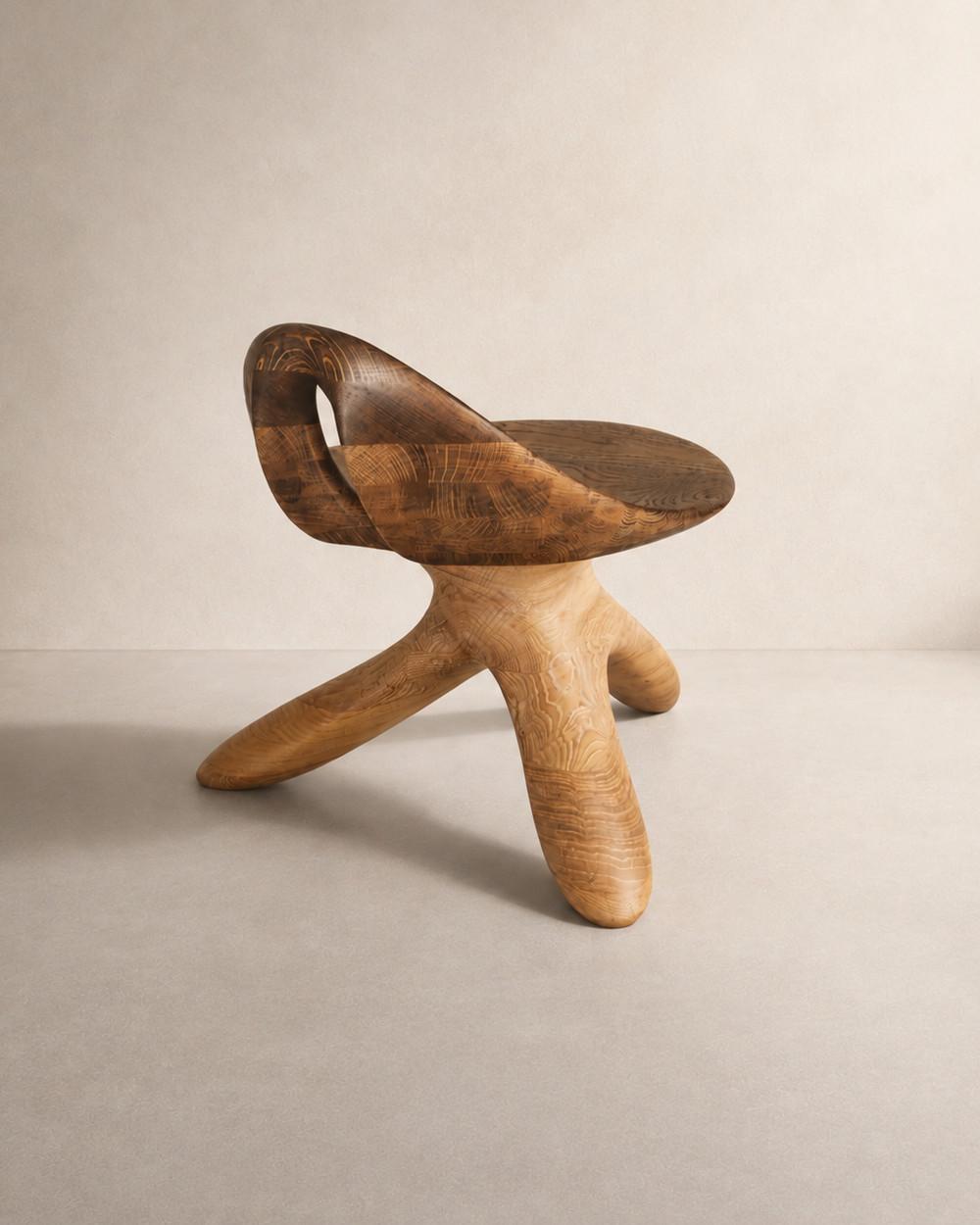 Morphe by NEXART — A sculptural wooden chair with a wraparound seat and a distinctive three-legged form