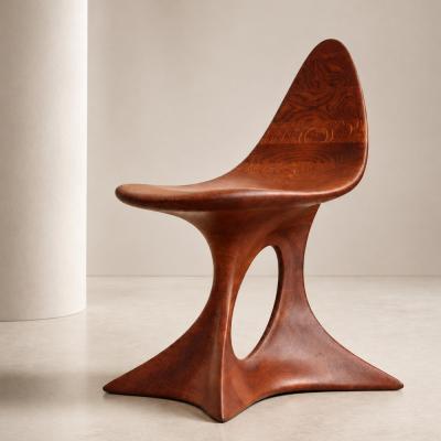 Aphrodite by NEXART — A sculptural wooden chair with a tapered back and an open, flowing base