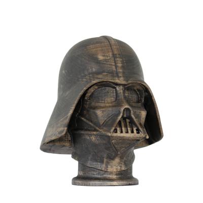Darth-Vader by NEXART — A wooden sculpture depicting the Darth Vader helmet, with carved details and a dark finish