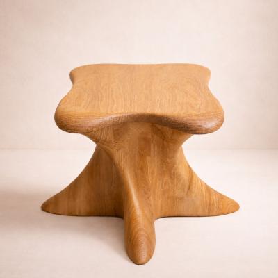 Harmonia by NEXART — A wooden stool with a broad, sculpted seat and softly curved supports