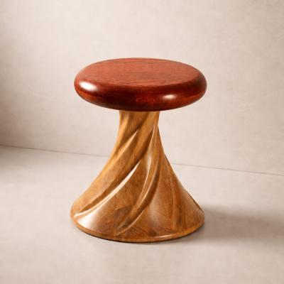 Hera by NEXART — A wooden stool with a rounded seat and a twisting sculptural base
