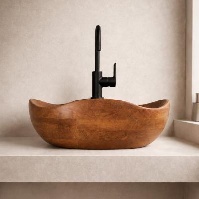 Vesta by NEXART — A rounded wooden washbasin with an organic rim and a warm natural character